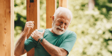 Man holding his shoulder in pain