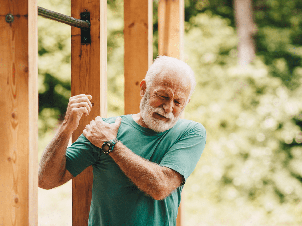 Man holding his shoulder in pain